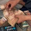 As Afghanistan’s central bank governor flees, currency drops
